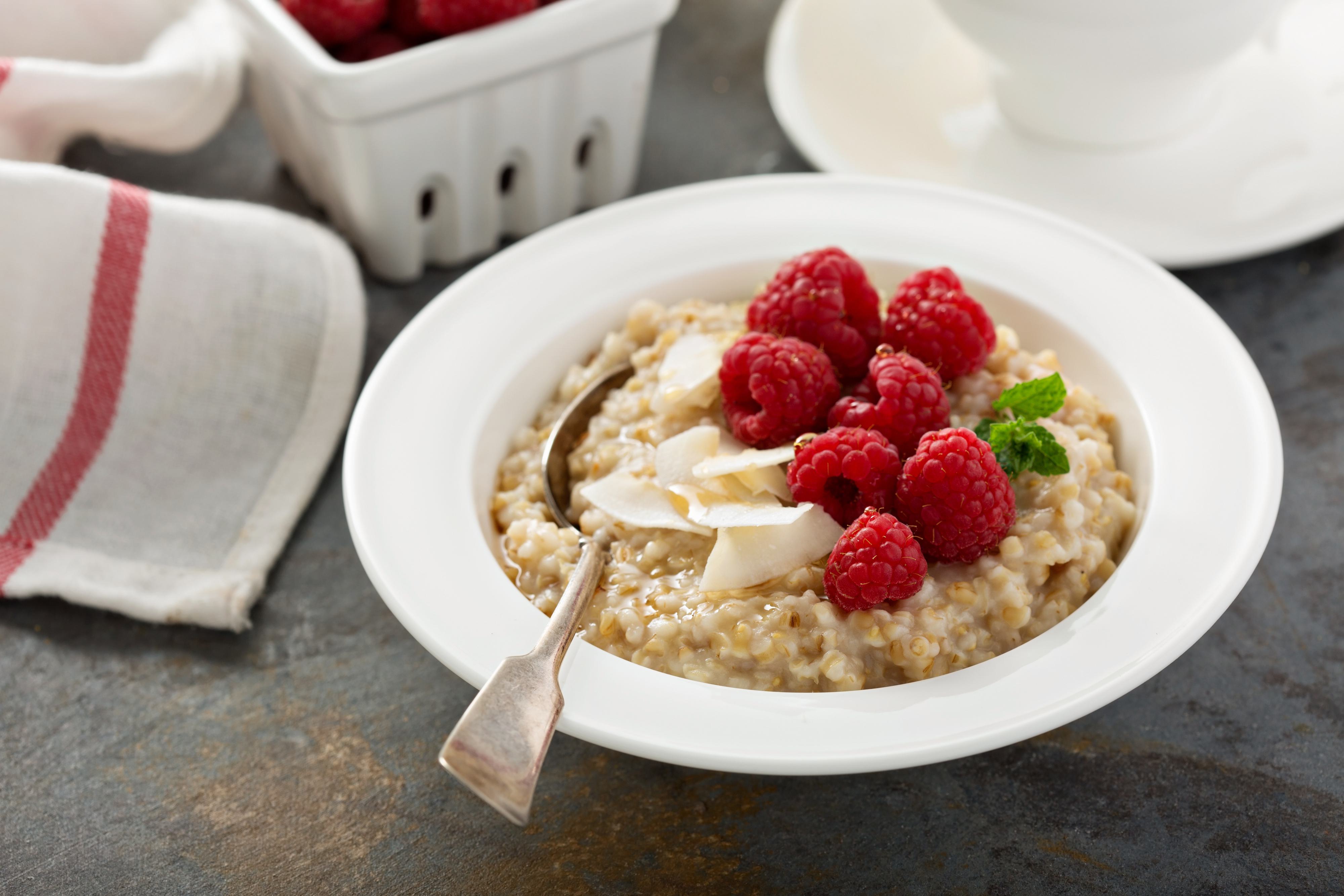 bowl of steel cut oats with raspberries