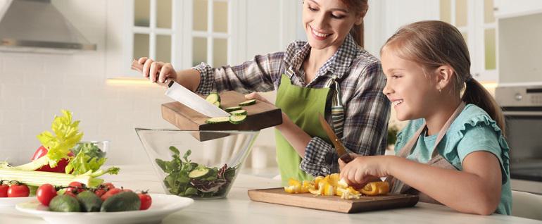 Kid Helping In Kitchen When Can Kids Start Helping in the… | Bob's Red Mill Natural Foods