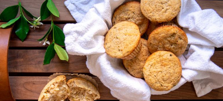 A basket full of Gluten Free Lemon Zucchini Muffins