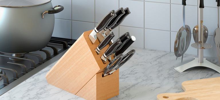 Kitchen knives with wooden block on the kitchen desk