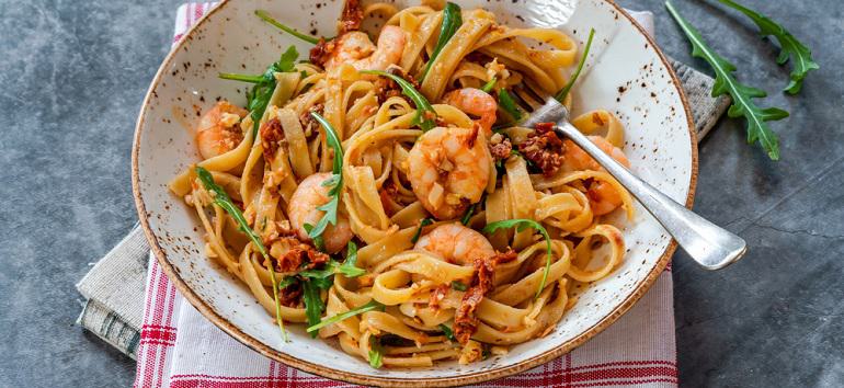 Tiger prawns in tomato, chilli and almond pesto with fettuccine pasta