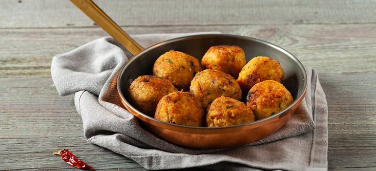 Lentil and millet meatballs. Served on tomato salsa with buckwheat