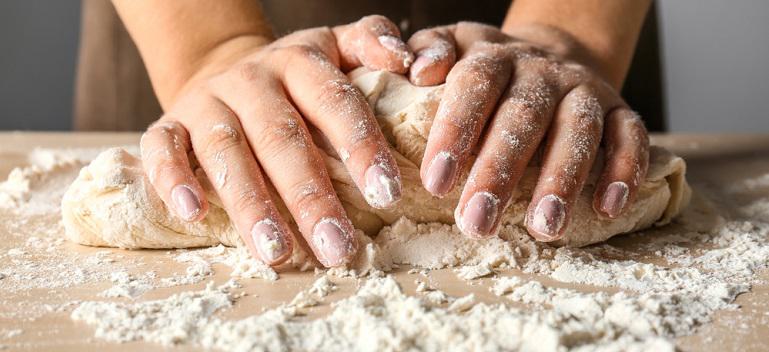 kneading pizza dough